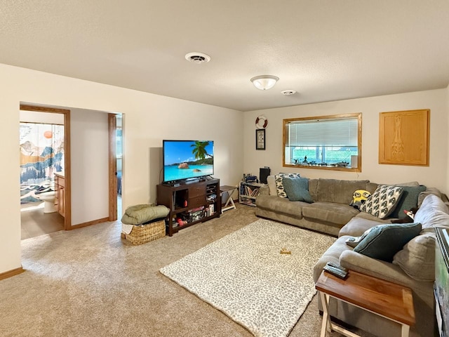 carpeted living area featuring visible vents