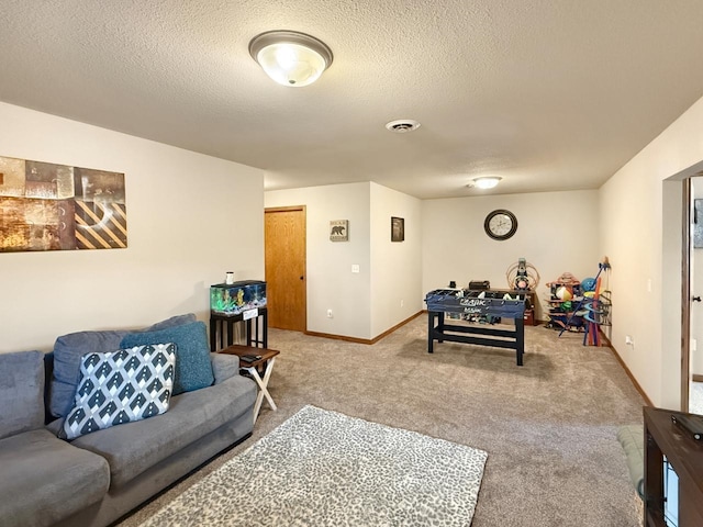 living room with a textured ceiling, baseboards, visible vents, and carpet