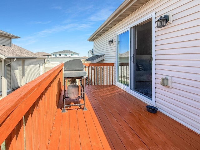 wooden terrace featuring grilling area