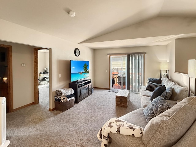 living room with lofted ceiling, carpet flooring, and baseboards
