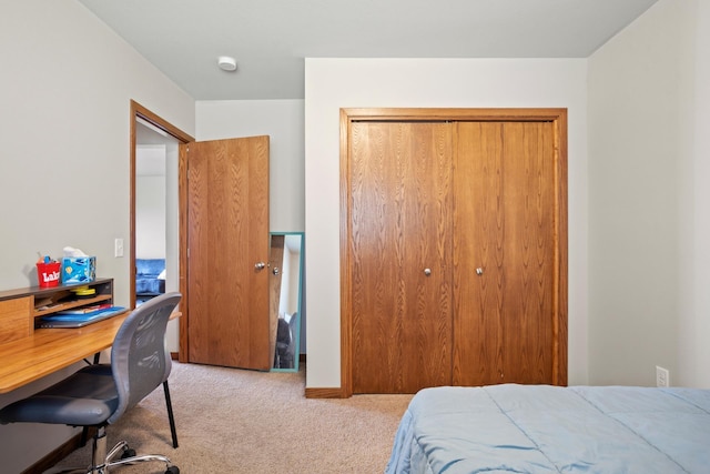 carpeted bedroom with a closet