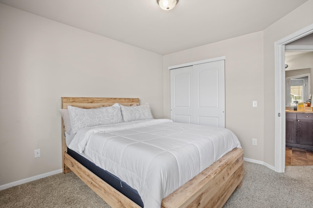2344 NW 14th St, Minot, ND 58703 - bedroom with carpet, a closet, and baseboards