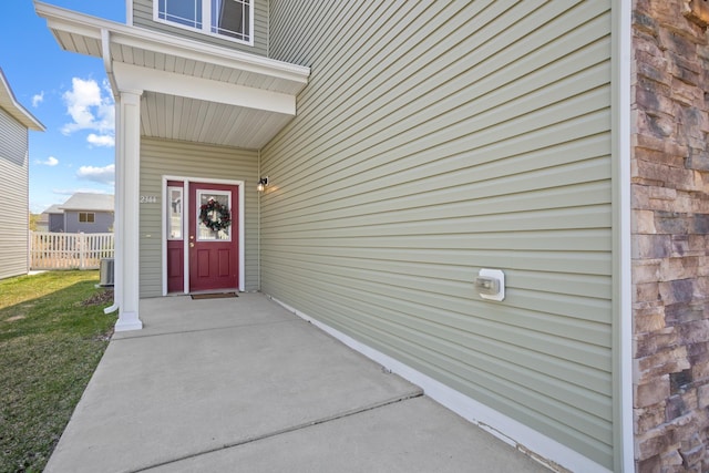 2344 NW 14th St, Minot, ND 58703 - entrance to property featuring central air condition unit and fence