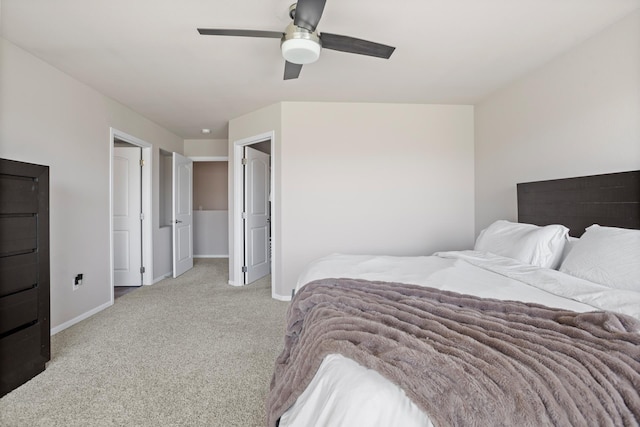 2344 NW 14th St, Minot, ND 58703 - bedroom featuring light colored carpet, baseboards, and ceiling fan