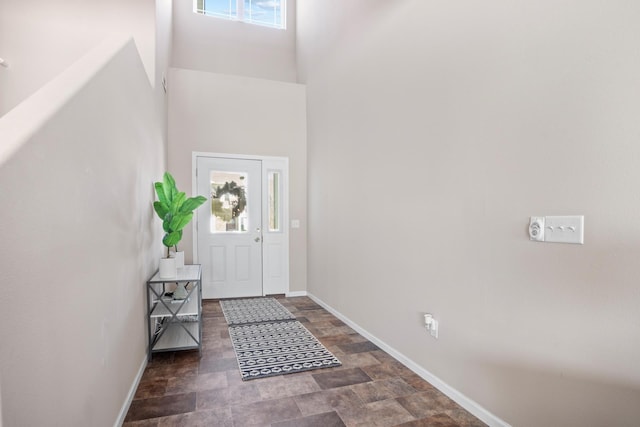 2344 NW 14th St, Minot, ND 58703 - foyer entrance featuring a towering ceiling, baseboards, and stone finish floor