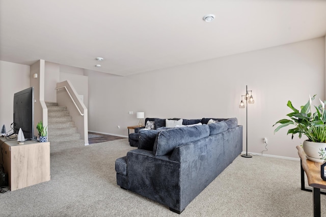 2344 NW 14th St, Minot, ND 58703 - carpeted living room with stairs and baseboards
