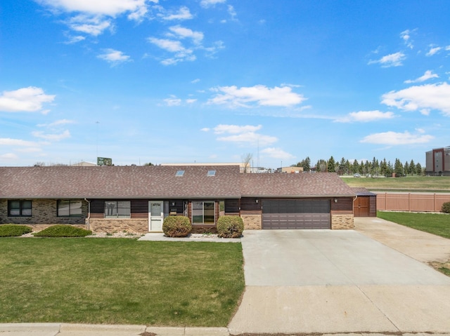 600 SW 24th Ave, Minot, ND 58701 - ranch-style home with concrete driveway, a front lawn, brick siding, and an attached garage