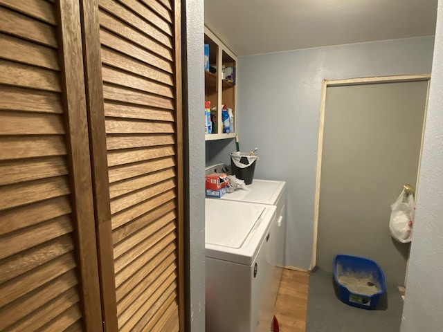 1601 72nd St, Minot, ND 58701 - clothes washing area featuring wood finished floors and washing machine and clothes dryer