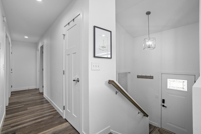 114 Mulberry Loop, Minot, ND 58703 - entryway with baseboards, dark wood-type flooring, recessed lighting, and a chandelier
