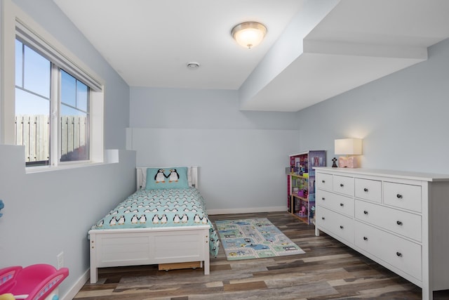 114 Mulberry Loop, Minot, ND 58703 - bedroom featuring dark wood-style flooring and baseboards