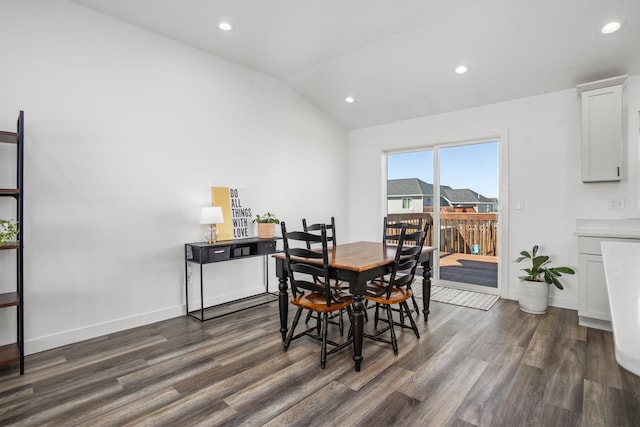 114 Mulberry Loop, Minot, ND 58703 - dining space with dark wood-style flooring, vaulted ceiling, recessed lighting, and baseboards