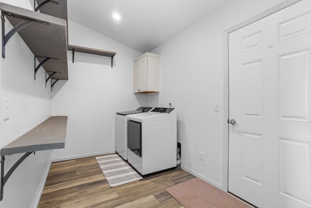 1504 Valley Bluffs Dr, Minot, ND 58701 - clothes washing area featuring cabinet space, independent washer and dryer, wood finished floors, baseboards, and recessed lighting