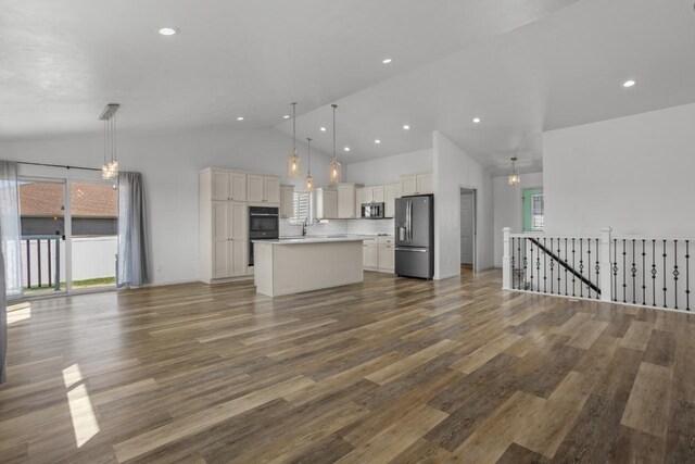 1504 Valley Bluffs Dr, Minot, ND 58701 - unfurnished living room featuring dark wood-style floors, high vaulted ceiling, a sink, and recessed lighting
