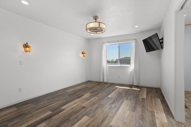 1504 Valley Bluffs Dr, Minot, ND 58701 - unfurnished room with wood finished floors, recessed lighting, and baseboards