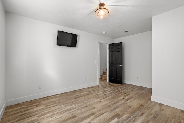 1504 Valley Bluffs Dr, Minot, ND 58701 - unfurnished room with light wood-style floors and baseboards