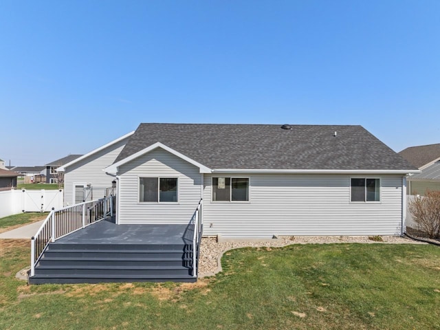 1504 Valley Bluffs Dr, Minot, ND 58701 - back of house featuring a wooden deck and a shingled roof