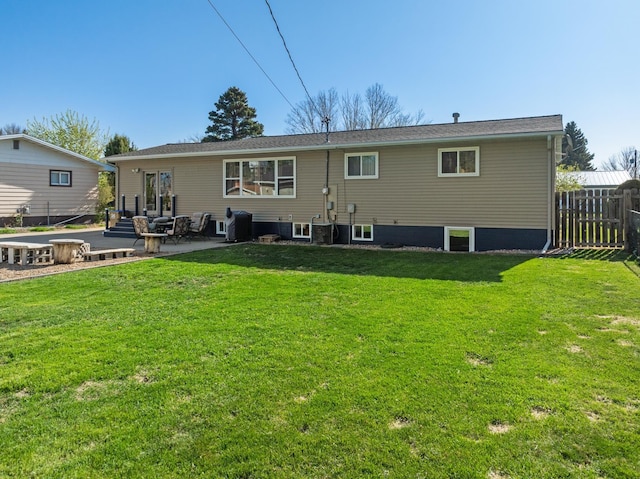 1722 1st St, Minot, ND 58701 - rear view of house featuring a patio