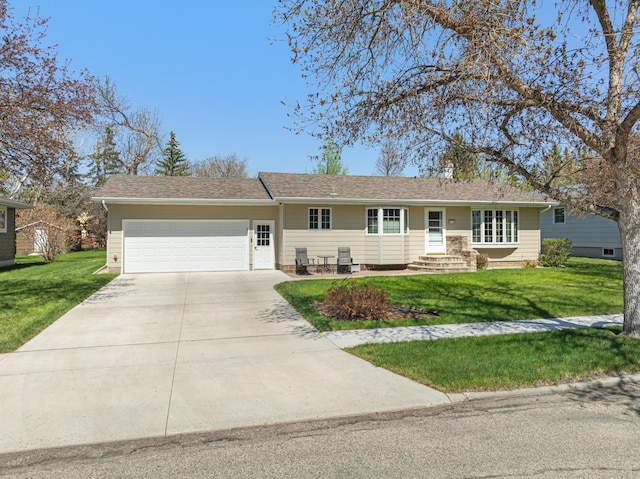 414 10th St, Bottineau, ND 58318 - single story home featuring a garage, driveway, and a front lawn