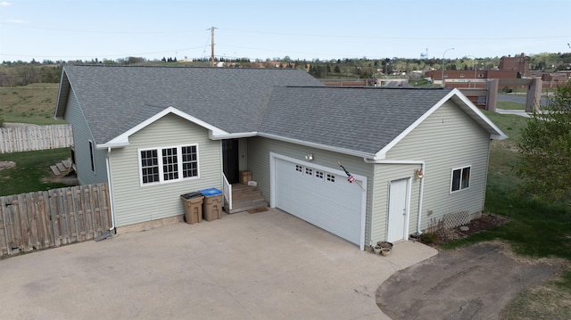 611 16th St, Minot, ND 58701 - single story home featuring roof with shingles, fence, an attached garage, and concrete driveway