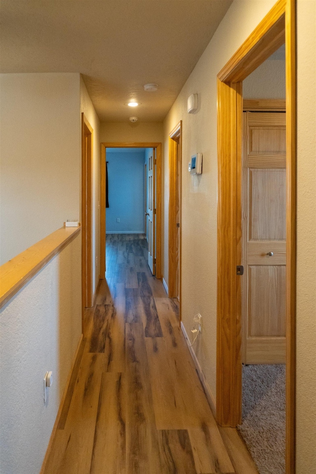 611 16th St, Minot, ND 58701 - hall with wood finished floors and baseboards