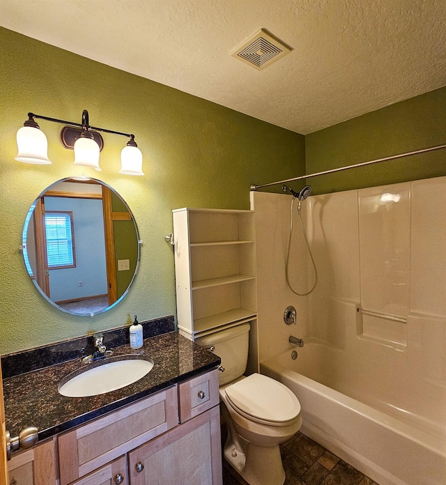 611 16th St, Minot, ND 58701 - full bath featuring a textured ceiling, vanity, toilet, shower / bath combination, and a textured wall