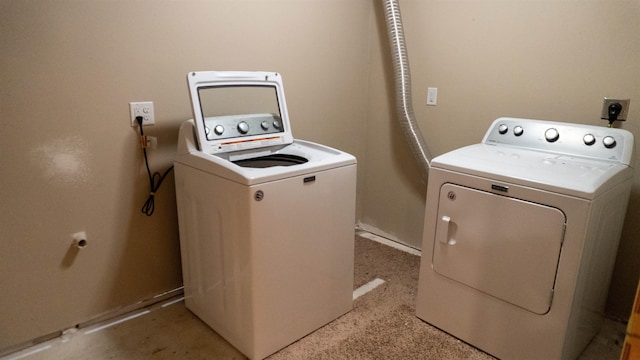 611 16th St, Minot, ND 58701 - laundry room featuring washing machine and dryer and baseboards