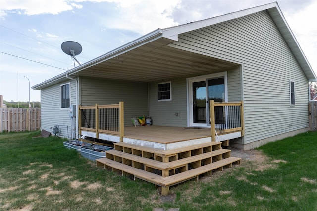 611 16th St, Minot, ND 58701 - back of house with a wooden deck