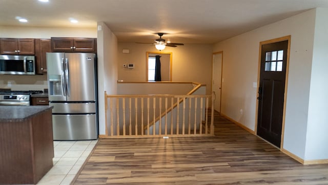 611 16th St, Minot, ND 58701 - kitchen featuring appliances with stainless steel finishes, dark countertops, ceiling fan, recessed lighting, and dark brown cabinetry