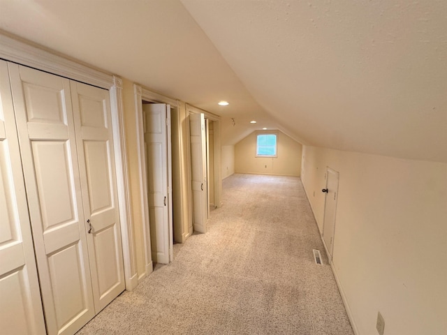 701 9th Ave, Minot, ND 58703 - bonus room featuring light colored carpet, vaulted ceiling, and recessed lighting