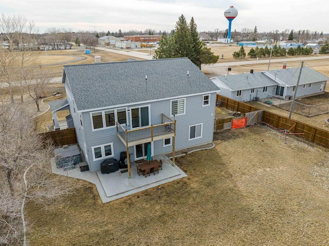 615 2nd St, Garrison, ND 58540 - back of house featuring a shingled roof, a patio area, and a residential view