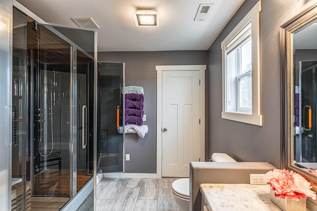 615 2nd St, Garrison, ND 58540 - full bath featuring a stall shower, toilet, vanity, baseboards, and marble finish flooring