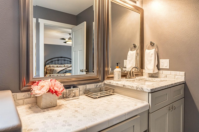 615 2nd St, Garrison, ND 58540 - bathroom with vanity, a textured wall, and a ceiling fan
