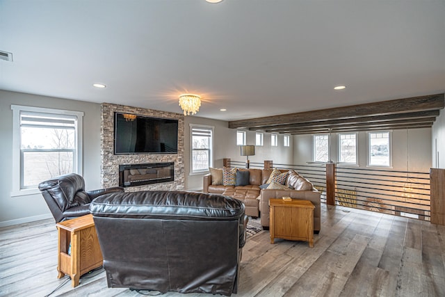615 2nd St, Garrison, ND 58540 - living area with wood finished floors, recessed lighting, a large fireplace, and baseboards