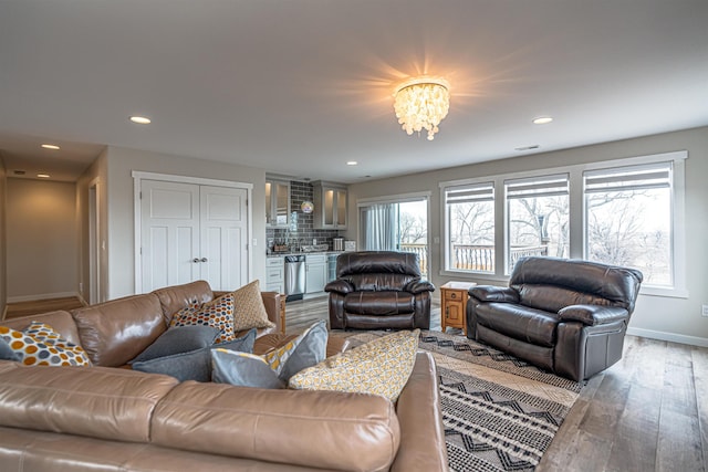 615 2nd St, Garrison, ND 58540 - living room featuring wood finished floors, baseboards, and recessed lighting