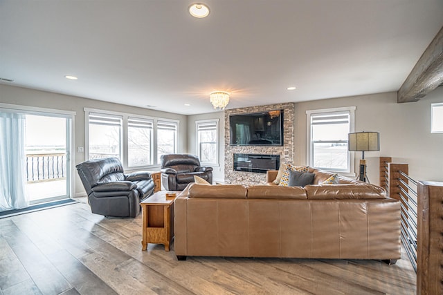 615 2nd St, Garrison, ND 58540 - living area with healthy amount of natural light, light wood-style floors, a fireplace, and recessed lighting