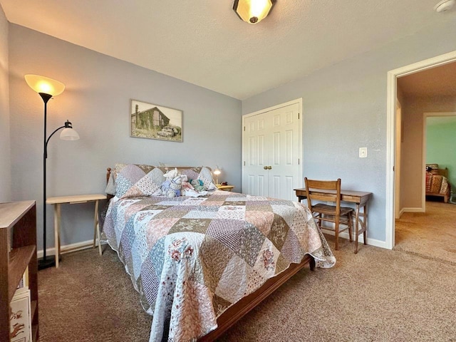 1312 28th St, Minot, ND 58703 - bedroom with carpet floors, a closet, and baseboards