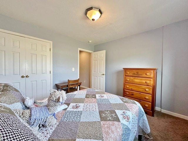1312 28th St, Minot, ND 58703 - bedroom featuring carpet, a closet, and baseboards