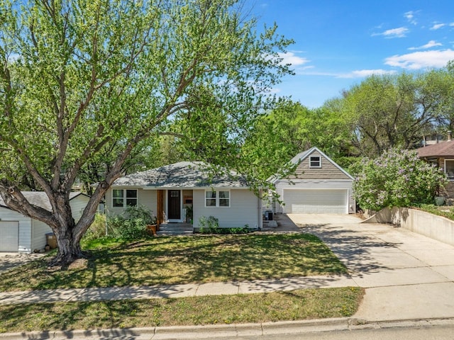 1001 20th St, Minot, ND 58703 - ranch-style home with concrete driveway, a front lawn, and an attached garage