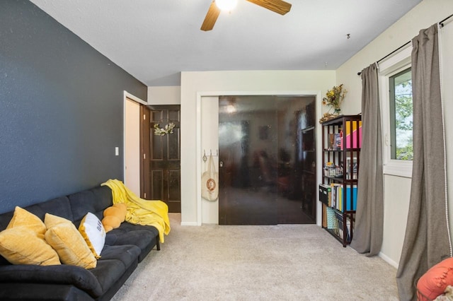 1001 20th St, Minot, ND 58703 - carpeted living room featuring a ceiling fan and baseboards