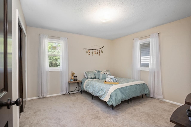1001 20th St, Minot, ND 58703 - bedroom featuring carpet floors and baseboards