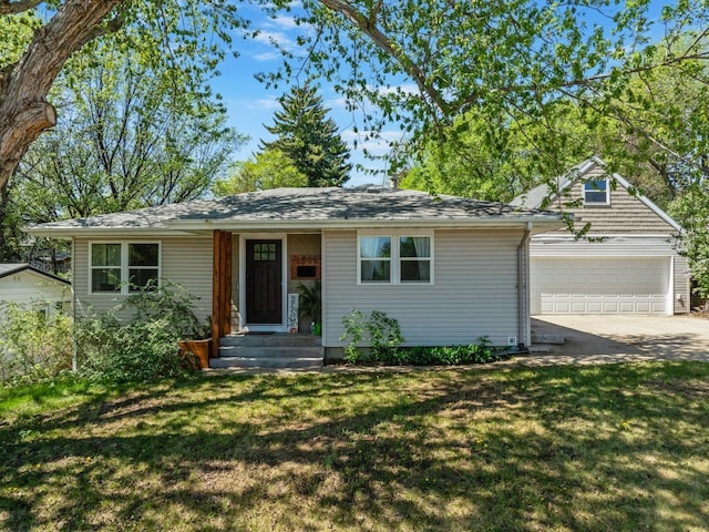 1001 20th St, Minot, ND 58703 - single story home featuring concrete driveway, an attached garage, and a front yard