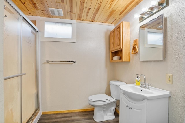 1001 20th St, Minot, ND 58703 - bathroom with wood ceiling, a stall shower, wood finished floors, toilet, and vanity