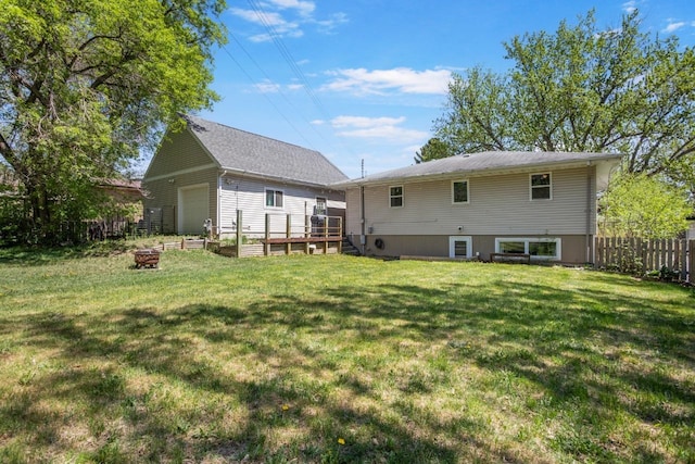 1001 20th St, Minot, ND 58703 - back of property featuring a fire pit and a deck