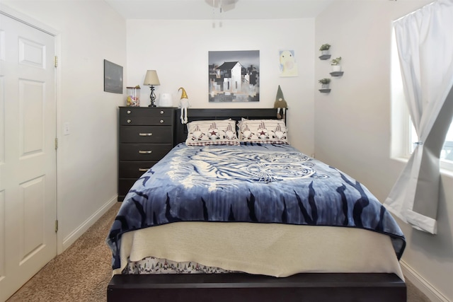 321 6th St, Minot, ND 58703 - carpeted bedroom with baseboards