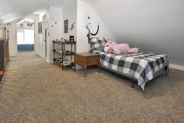 321 6th St, Minot, ND 58703 - bedroom featuring lofted ceiling, carpet floors, and baseboards