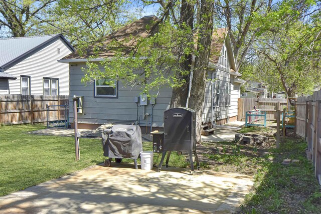 321 6th St, Minot, ND 58703 - back of property featuring a patio