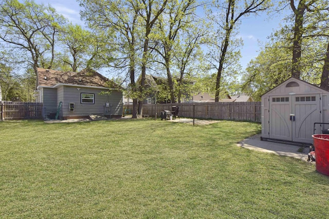 321 6th St, Minot, ND 58703 - view of yard featuring a shed and an outbuilding