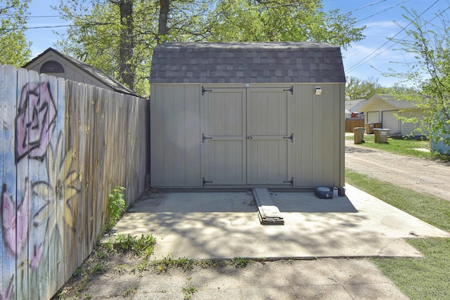 321 6th St, Minot, ND 58703 - view of shed featuring fence