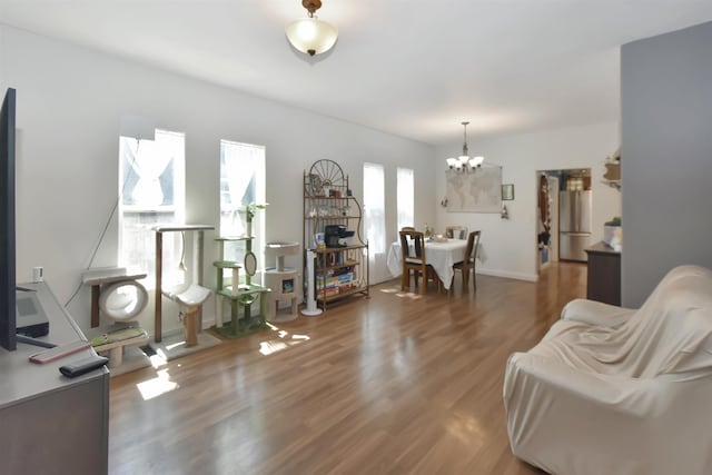 321 6th St, Minot, ND 58703 - living area with a chandelier and wood finished floors