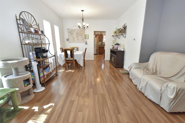 321 6th St, Minot, ND 58703 - living area with a chandelier and light wood finished floors